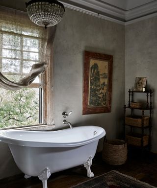 Grey bathroom with chandelier and Roxburgh bath by Victoria and Albert