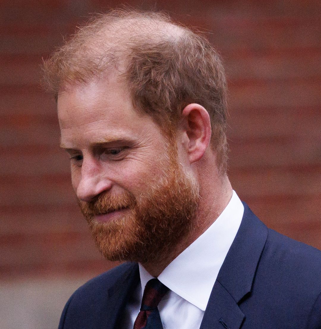 Prince Harry wearing a suit and tie 