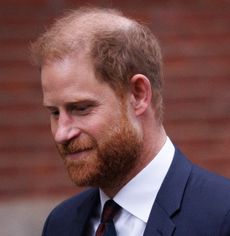 Prince Harry wearing a suit and tie 