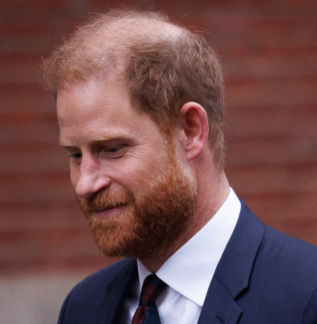 Prince Harry wearing a suit and tie 