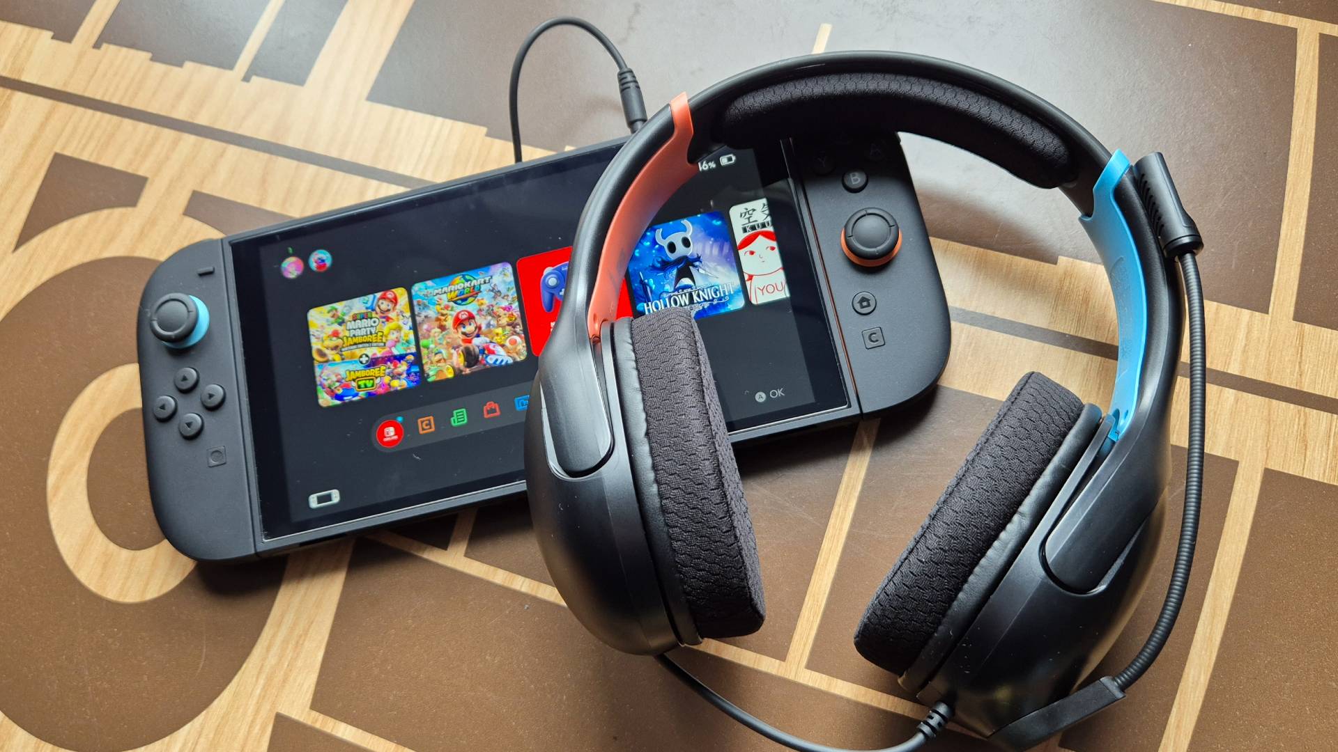 Photo by Rosalie Newcombe of the Turtle Beach Airtlite Fit wired headset for the Switch 2, on a wooden coffee table.