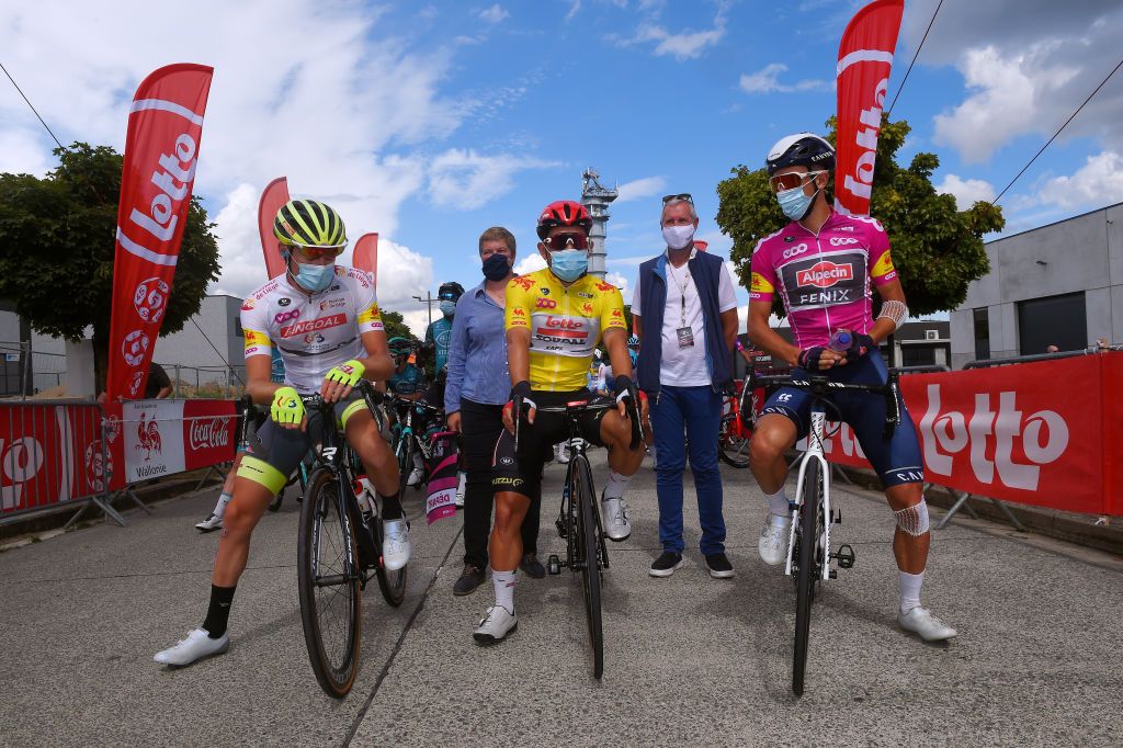 WAVRE BELGIUM AUGUST 17 Start Tom Paquot of Belgium and Team Bingoal WB White Mountain Jersey Caleb Ewan of Australia and Team Lotto Soudal Yellow Leader Jersey Dries De Bondt of Belgium and Team AlpecinFenix Pink Sprint Jersey Covid safety measures during the 41st Tour de Wallonie 2020 Stage 2 a 1723km stage from Frasnes Lez Anvaing to Wavre TourdeWallonie TRW2020 on August 17 2020 in Wavre Belgium Photo by Luc ClaessenGetty Images