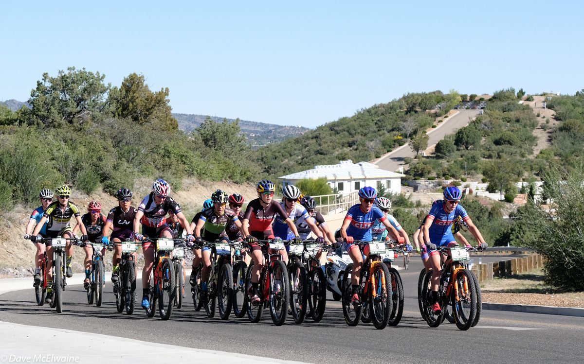 The women&rsquo;s peloton was paced up the initial road climb by the Cliff women