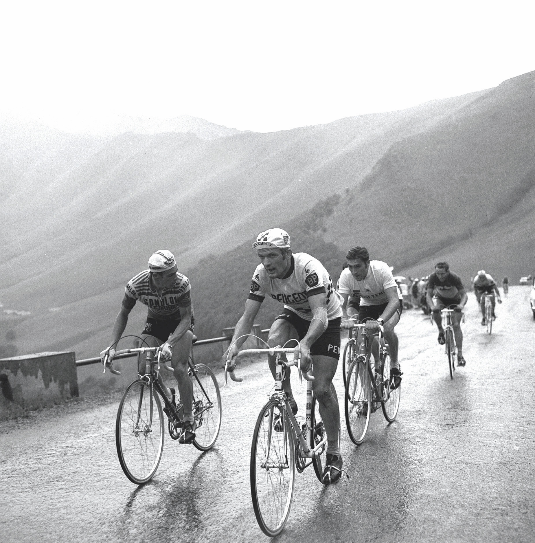 Eddy Merckx rides without the leaders yellow jersey as he climbs with Lucien Van Impe and Bernard Thevenet.