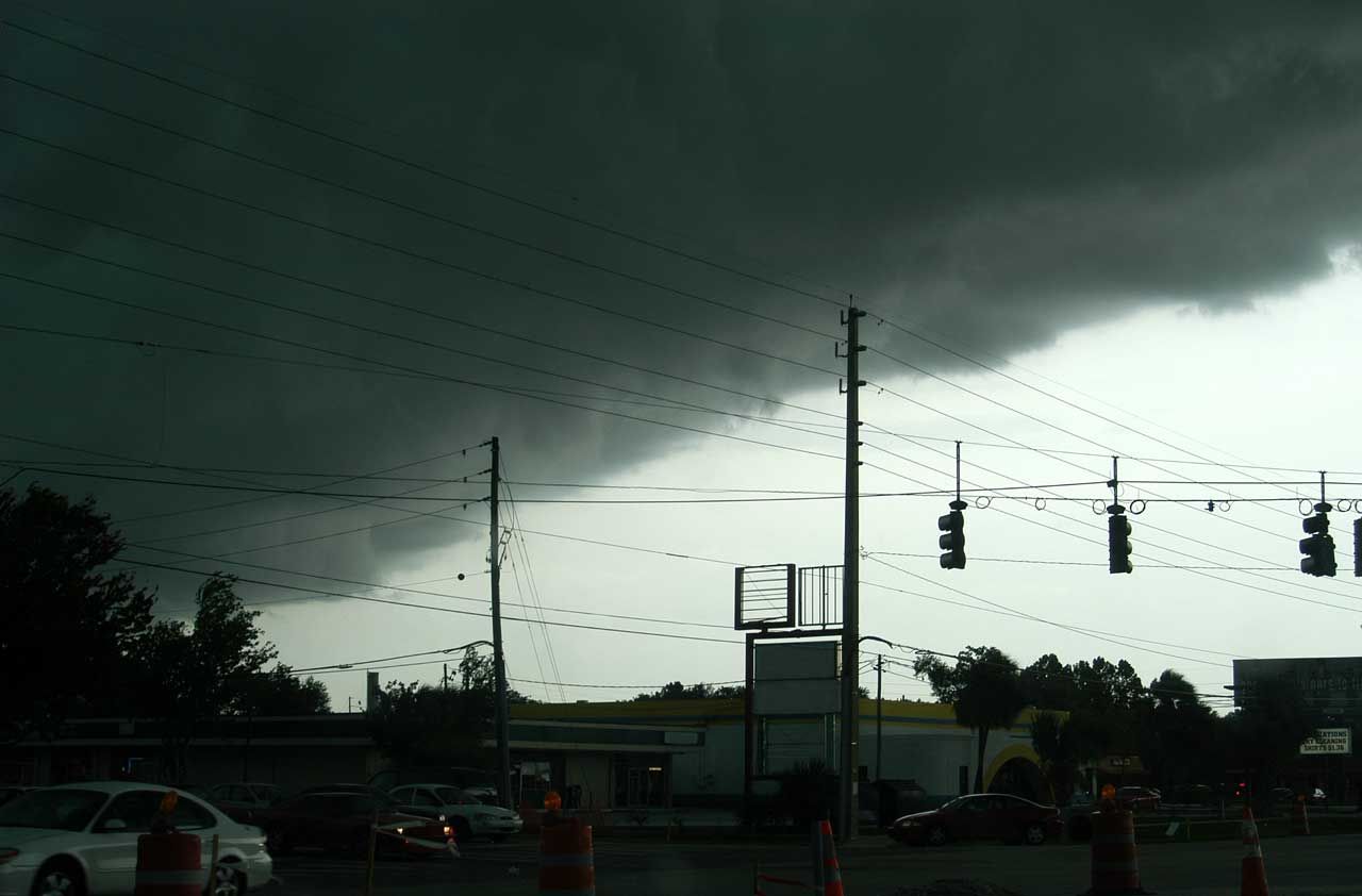 Heavy clouds from a hurricane hover over a city