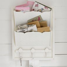 white colour hanging storage and letters
