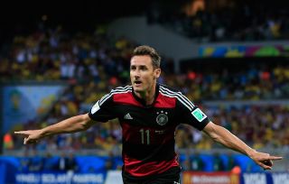 Miroslav Klose celebrates after scoring for Germany against Brazil at the 2014 World Cup.