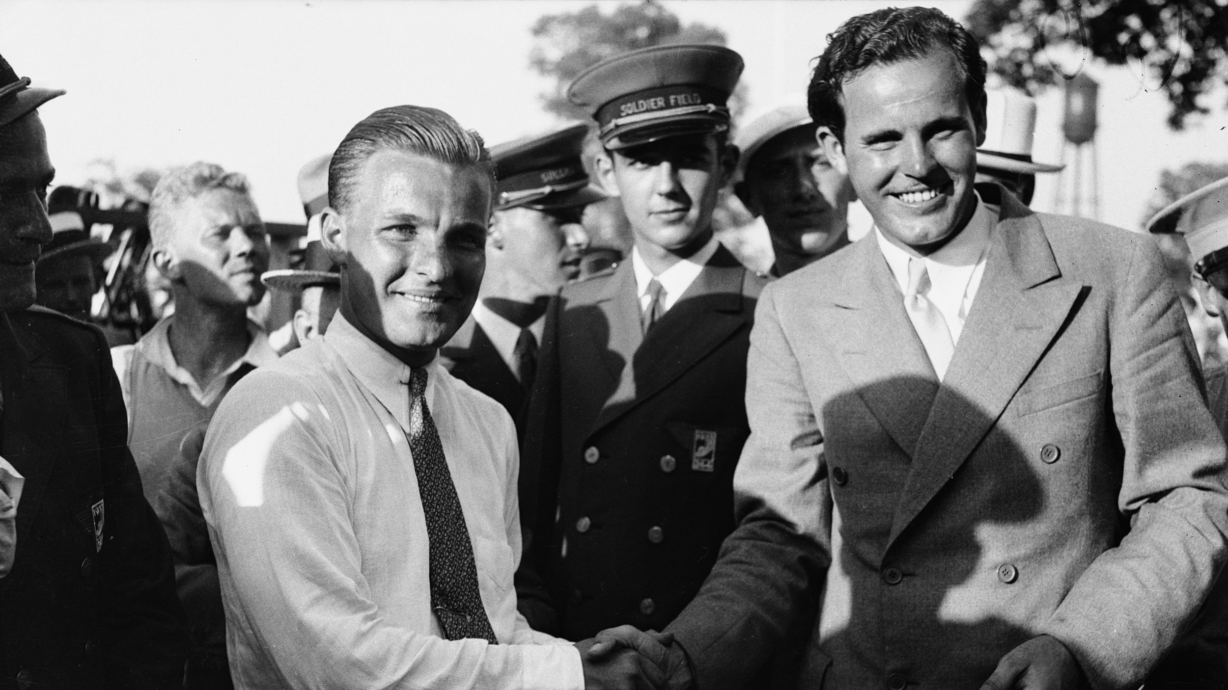 1933 US Open champion, Johnny Goodman (left) shakes hands with Ralph Guldhal