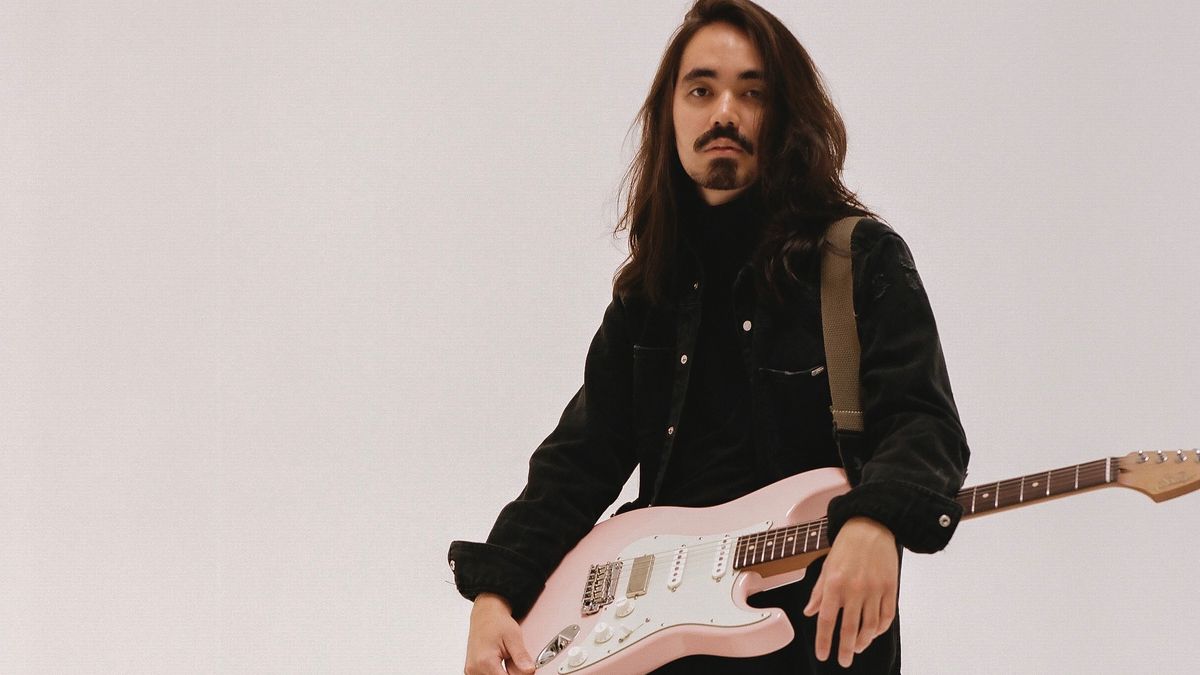 Mateus Asato with his pink Suhr signature guitar