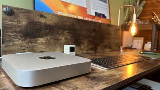 M2 Mac mini on a wooden desk