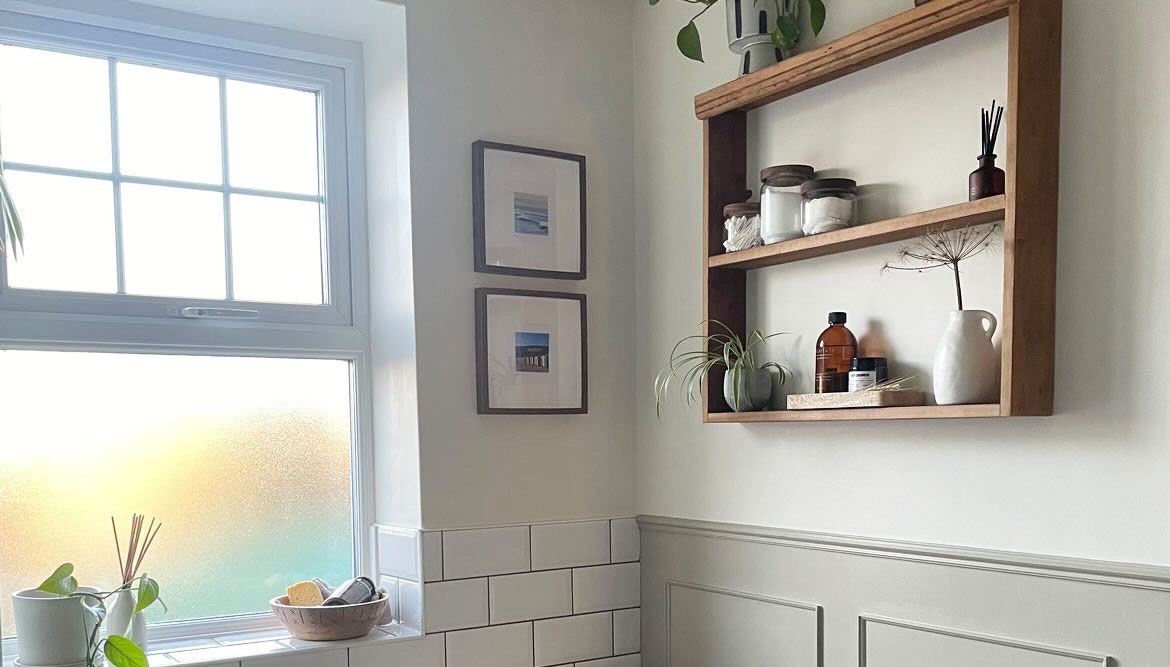 Bright airy bathroom with metro tiling and built-in storage