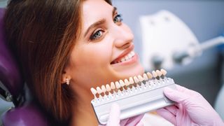 Is teeth whitening safe? Image shows woman at dentist