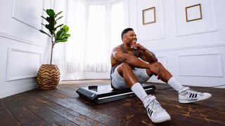 person sitting on the Vitruvian V-Form Trainer