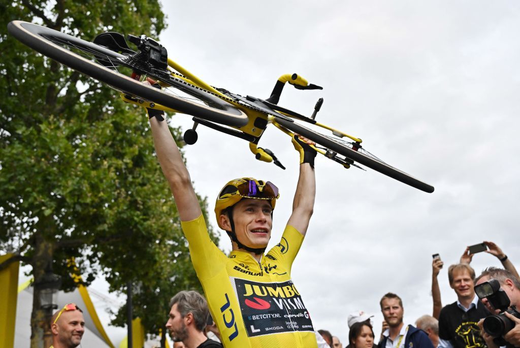 JumboVismas Danish rider Jonas Vingegaard wearing the overall leaders yellow jersey celebrates victory by lifting his bike at the end the 21st and final stage of the 110th edition of the Tour de France cycling race 115 km between SaintQuentinenYvelines and the ChampsElysees in Paris on July 23 2023 Photo by Marco BERTORELLO POOL AFP Photo by MARCO BERTORELLOPOOLAFP via Getty Images