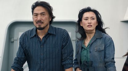 Hiroshi and Keiko standing on a boat in Monarch: Legacy of Monsters season 2 episode 2