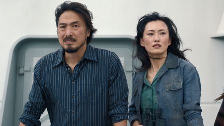 Hiroshi and Keiko standing on a boat in Monarch: Legacy of Monsters season 2 episode 2