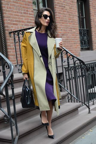 Amal Clooney walking down steps outside apartment in New York