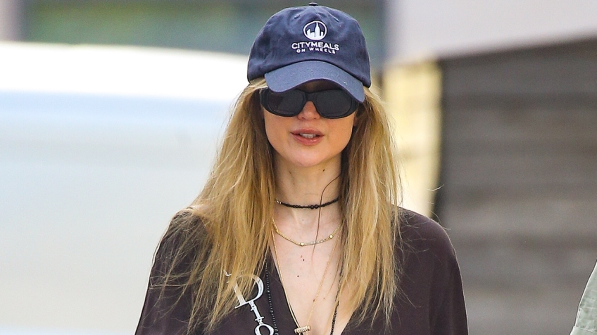 Jennifer Lawrence enjoyed the spring weather in last summer's favorite The Row Dune flip-flops and a monogrammed Dior bag