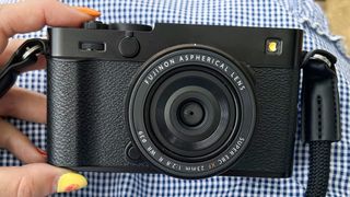 Hand holding the new Fujifilm X-E5 film simulation camera.