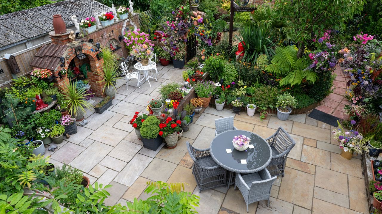 B&amp;Q Gardener of the Year Odette and Rob&#039;s zoned garden with container plants, archways and a patio area