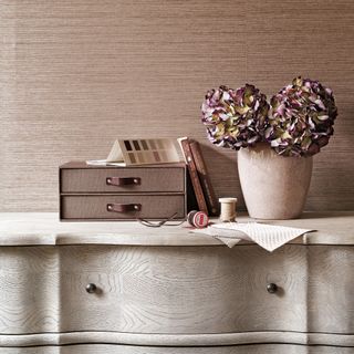 chest of drawers styled with vase of dried hydrangeas