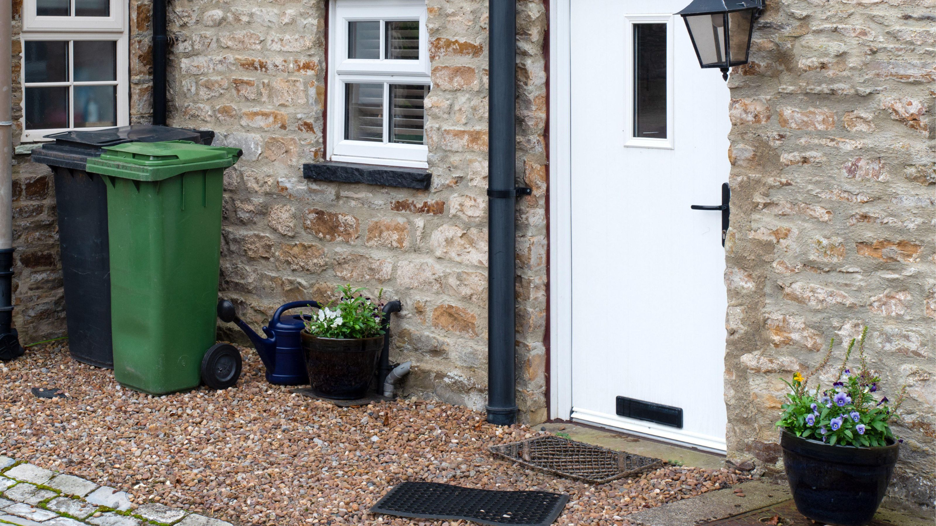 front garden with wheelie bins