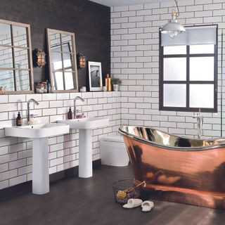 Bathroom with white brick designed tiles on wall and bathtub
