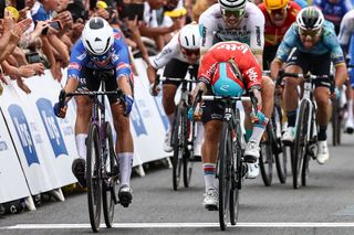 TOPSHOT - Alpecin-Deceuninck's Belgian rider Jasper Philipsen (L) sprints to the finish line ahead of Lotto Dstny's Australian rider Caleb Ewan (R) to win the 4th stage of the 110th edition of the Tour de France cycling race, 182 km between Dax and Nogaro, in southwestern France, on July 4, 2023. (Photo by Anne-Christine POUJOULAT / AFP) (Photo by ANNE-CHRISTINE POUJOULAT/AFP via Getty Images)