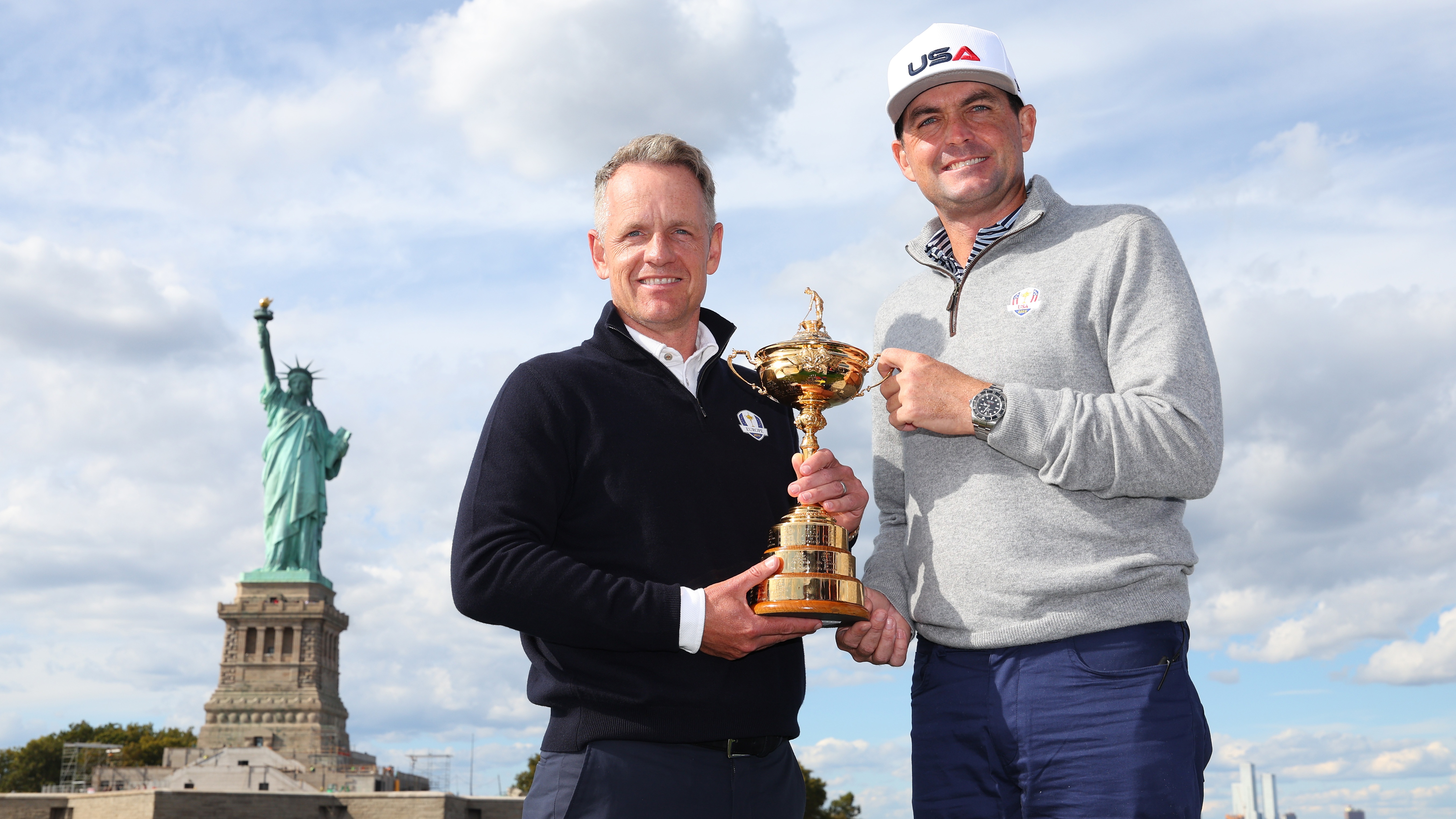 Team Captains Luke Donald of England and Keegan Bradley of The United States pose for a photograph with the Ryder Cup Trophy during the Ryder Cup 2024 Year to Go Media Event at the Statue of Liberty on October 08, 2024 in New York, New York.
