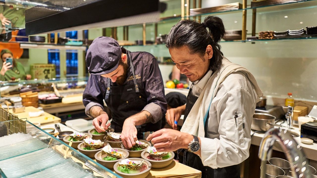 Chef Masaki Sugisaki prepares dishes at Dinings SW3 