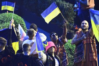 Members of Ukraine's band "Kalush Orchestra" celebrate their qualification during the first semifinal of the Eurovision Song contest 2022