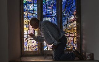 Tom Denny Stain Glass window maker. Photographed inside All Saints Church in Middle Woodford, Wiltshire. Photography by Richard Cannon on Friday 30th August 2018