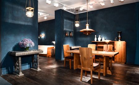 Wooden dining table with four chair in dining area.