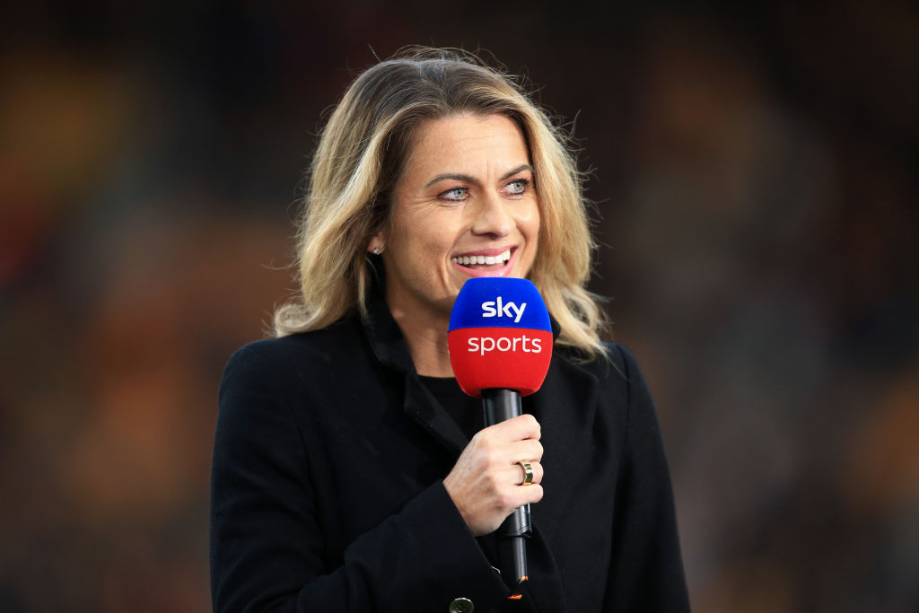 Sky Sports pitchside pundit Karen Carney holds the microphone during the Premier League match between Wolverhampton Wanderers and Manchester City at Molineux on May 11, 2022 in Wolverhampton, United Kingdom.