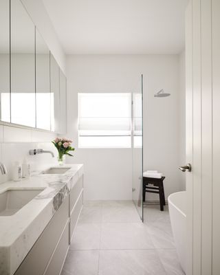 A bathroom with large format tiles