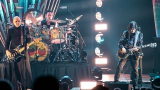 Singer/guitarist Billy Corgan, drummer Jimmy Chamberlain and guitarist James Iha of Smashing Pumpkins perform at PNC Music Pavilion on August 20, 2019 in Charlotte, North Carolina
