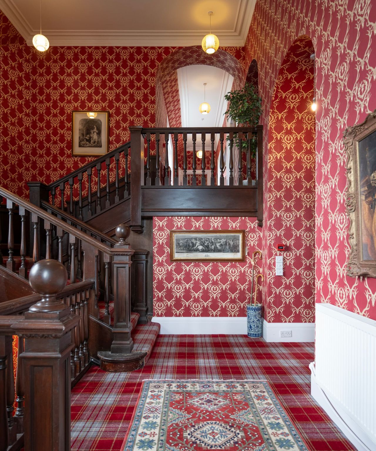 A dark wooden staircase on the second floor of the house