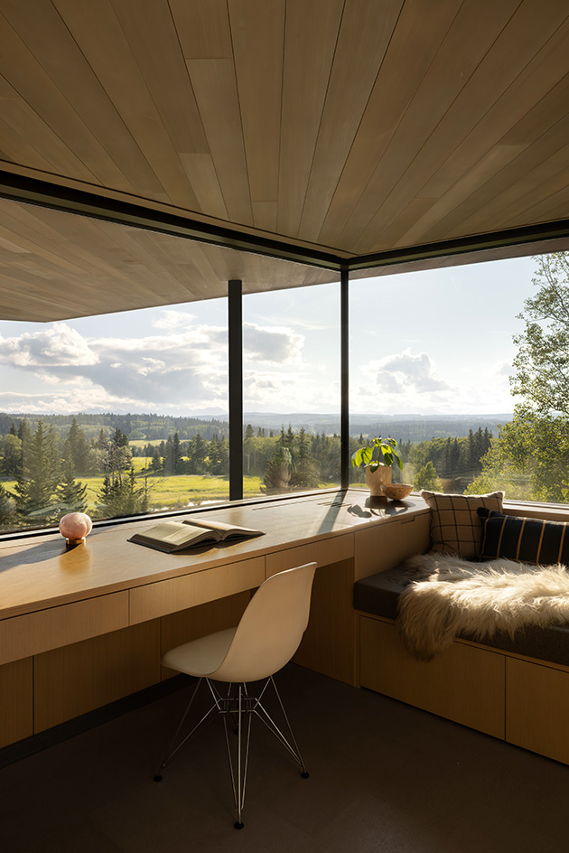 Cut Out House, a square footprint home with a round cut out set in the canadian winderness, by a lake