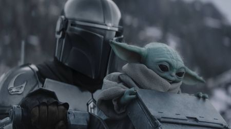 Pedro Pascal's Din Djarin and Baby Yoda in the snow in The Mandalorian and Grogu 
