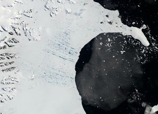 The Larsen B ice shelf on January 31, 2002. Melt ponds dot its surface. Scroll down for an after picture.