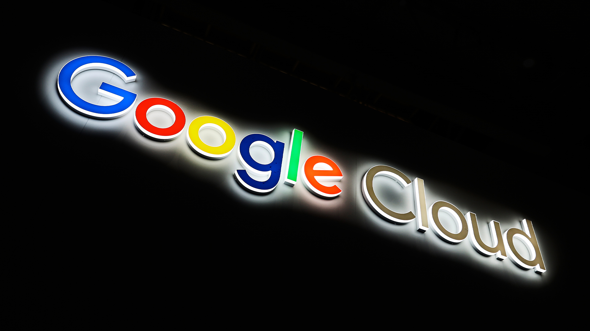 Google Cloud logo and branding illuminated against a dark backdrop at Mobile World Congress (MWC) 2025 in Barcelona, Spain.