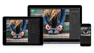 Lightroom AI shows a girl leaning forwards holding a feather, on tablet, laptop and phone screens