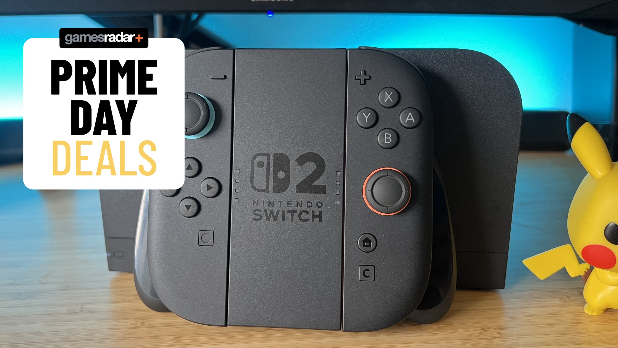 Nintendo Switch 2 Joy-Con and dock on a wooden desk with Prime Day deals badge