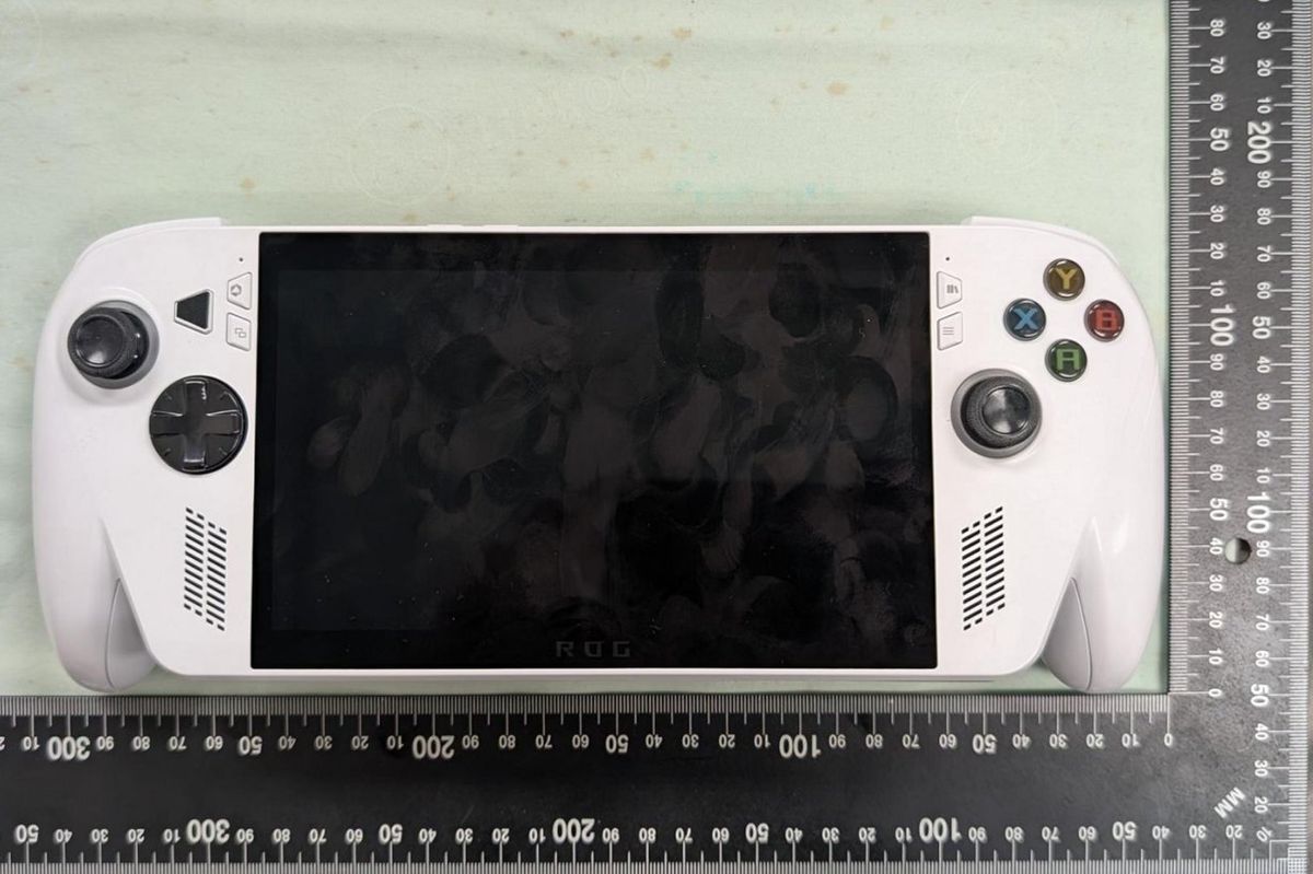 Photographs of an Asus ROG handheld gaming PC taken from FCC filings, showing the device's dimensions, new design, and button and port layout.