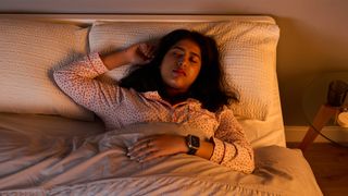 A close up of mattress tester Becky George sleeping at night