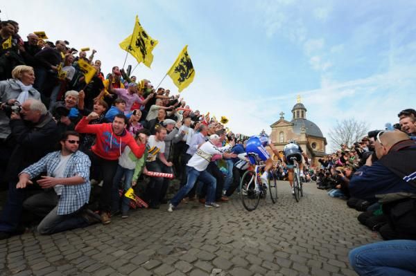 Chavanel and Cancellara are propelled up the Kapelmuur by the enthusiastic crowds