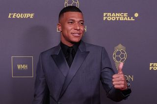 Paris Saint Germain's French forward Kylian Mbappe gestures a thumbs-up as he poses prior to the 2023 Ballon d'Or France Football award ceremony at the Theatre du Chatelet in Paris on October 30, 2023.
