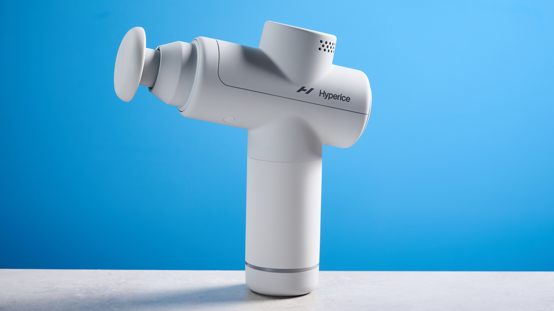 the hyperice hypervolt go 2 massage gun in white/gray with a bullet head attachment, flat head attachment, and a usb-c charging port