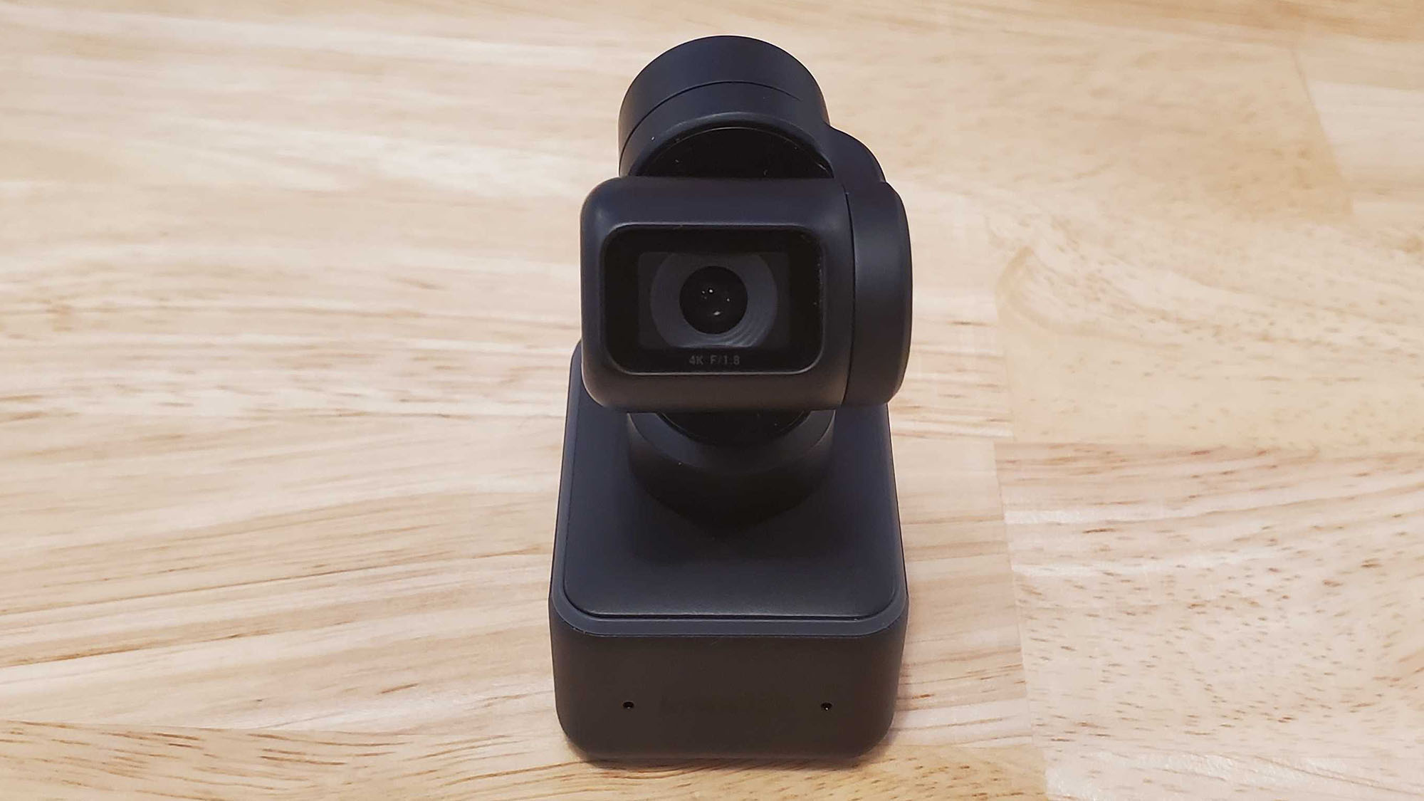 An Insta360 Link on a table without its tripod