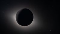 Pictures from Artemis II during the solar eclipse that the astronauts experienced from the dark side of the moon. This is a wide-angle shot showing the moon, the sun's corona, and stars in the background